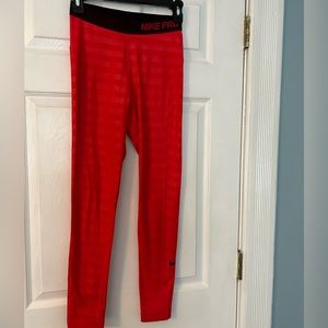 NIKE Pro, dri fit, size small running tights. Full length, red shadow stripe.